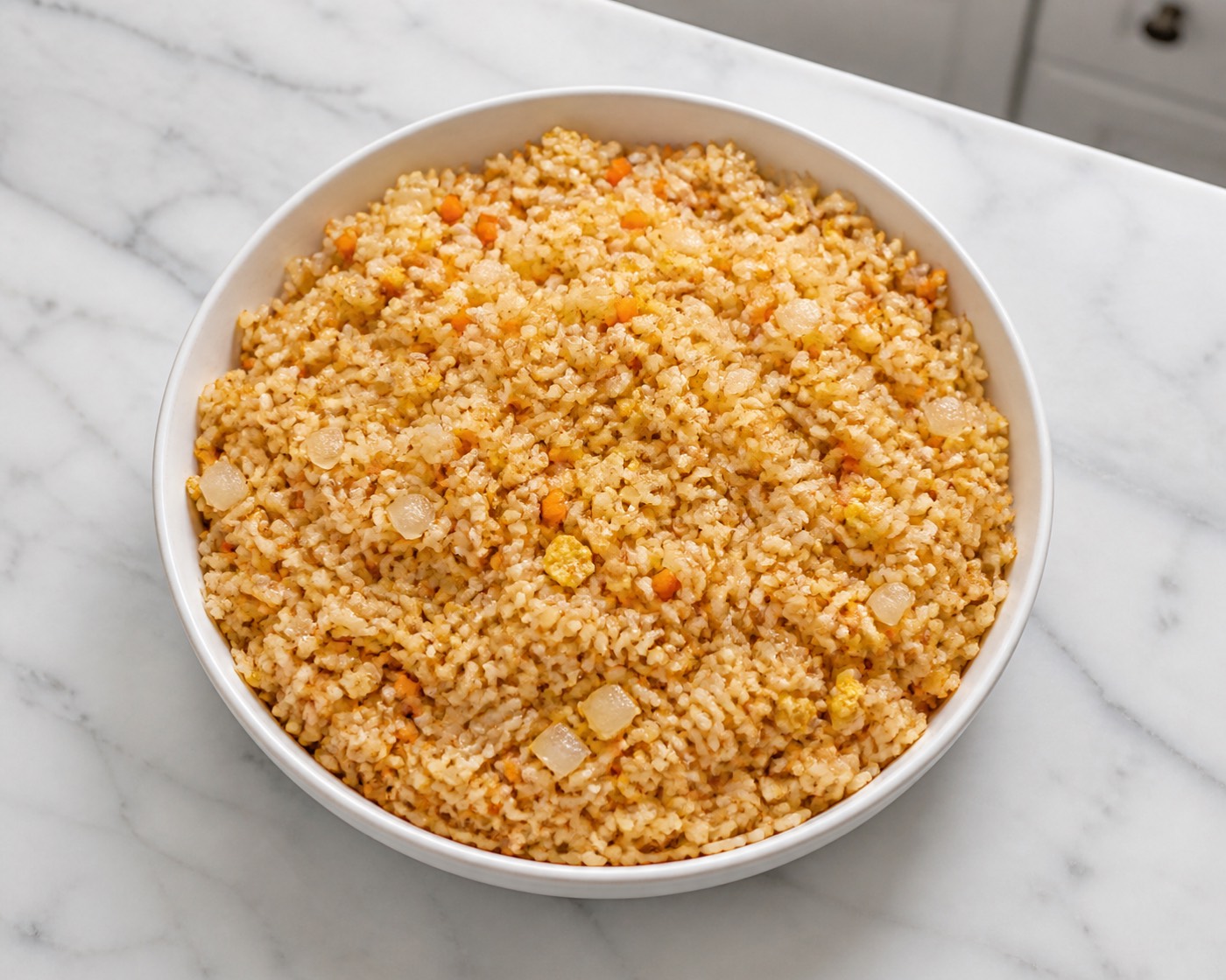 The Hibachi House Fried Rice served on a complete plate over white marble